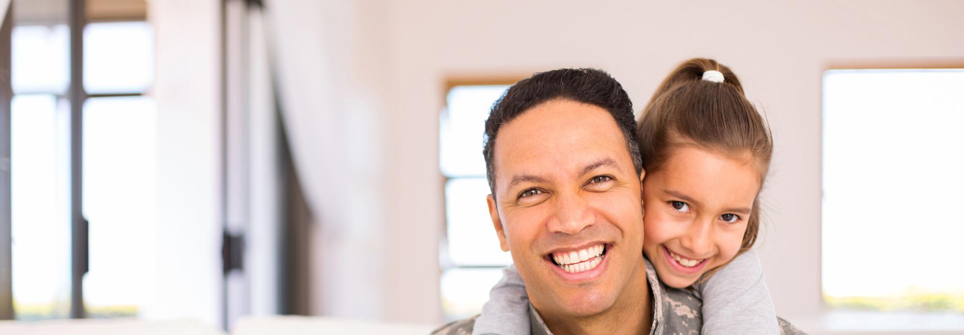 Military father and daughter at home 